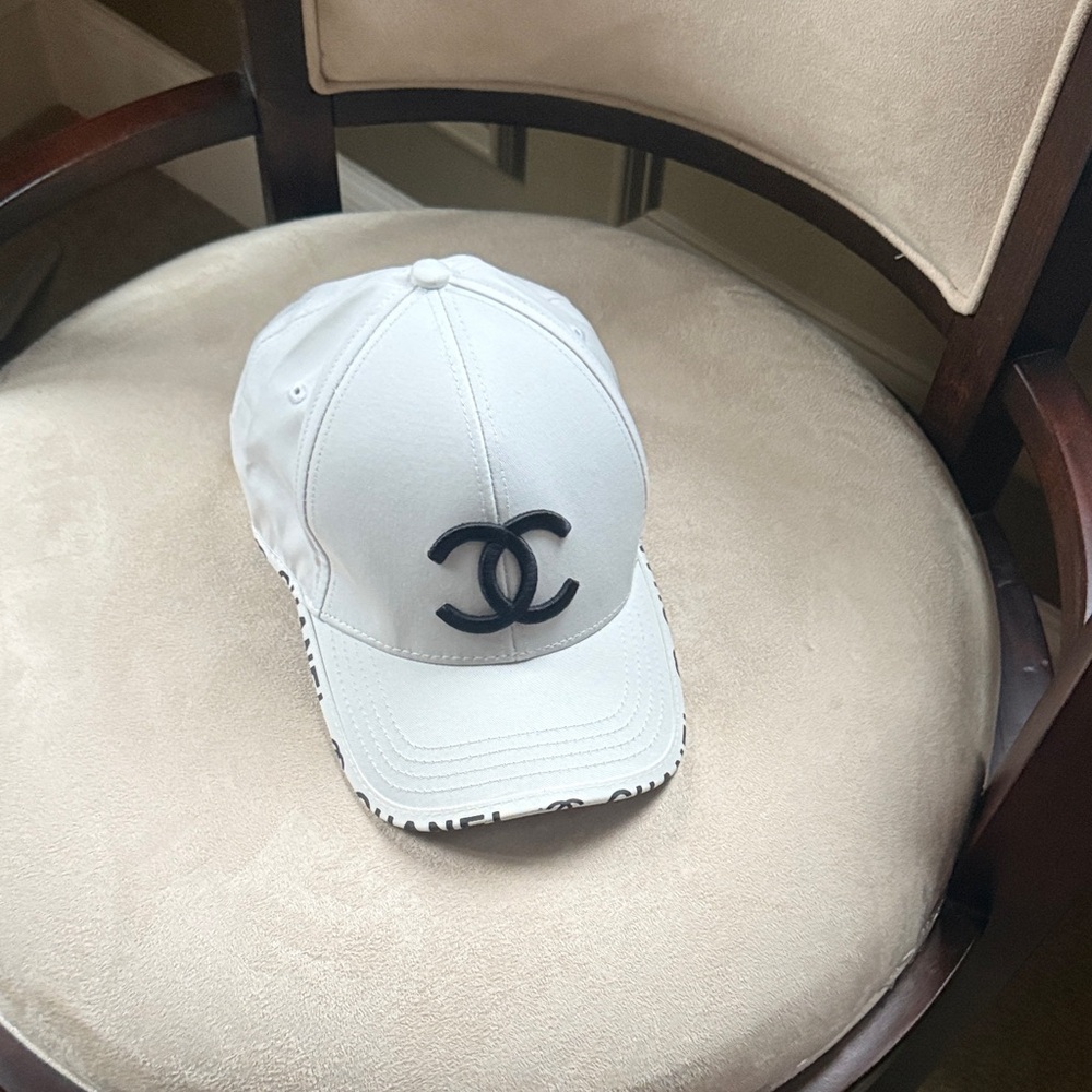 CHANEL White Cap with Black Emblem